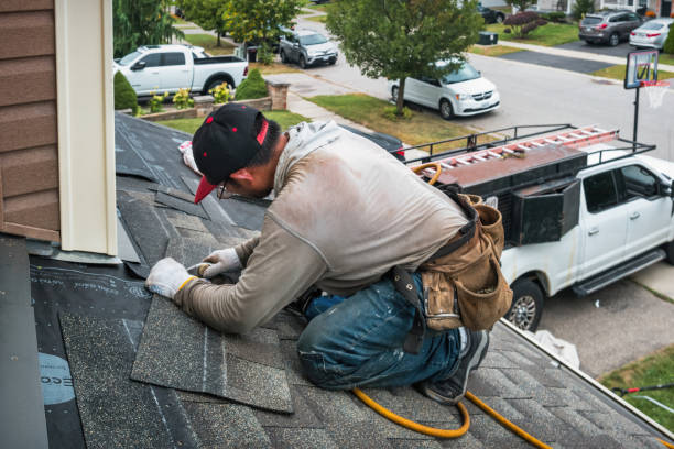 Professional Roofing technician working in Rhodes, IA